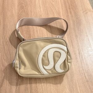lululemon athletica Beige Crossbody Bag with Cream Logo Patch